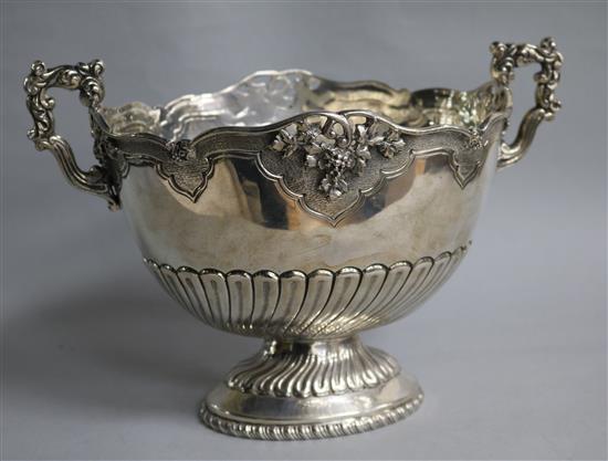 A demi fluted white metal two handled oval pedestal bowl,
